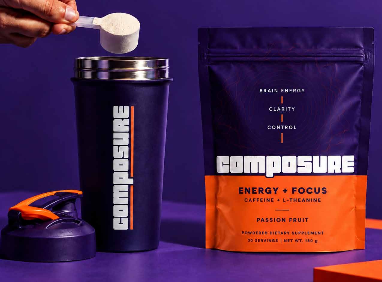 A scoop of COMPOSURE powder over a branded shaker